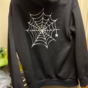 Stylish Black Zip-Up Sweater with Web Design